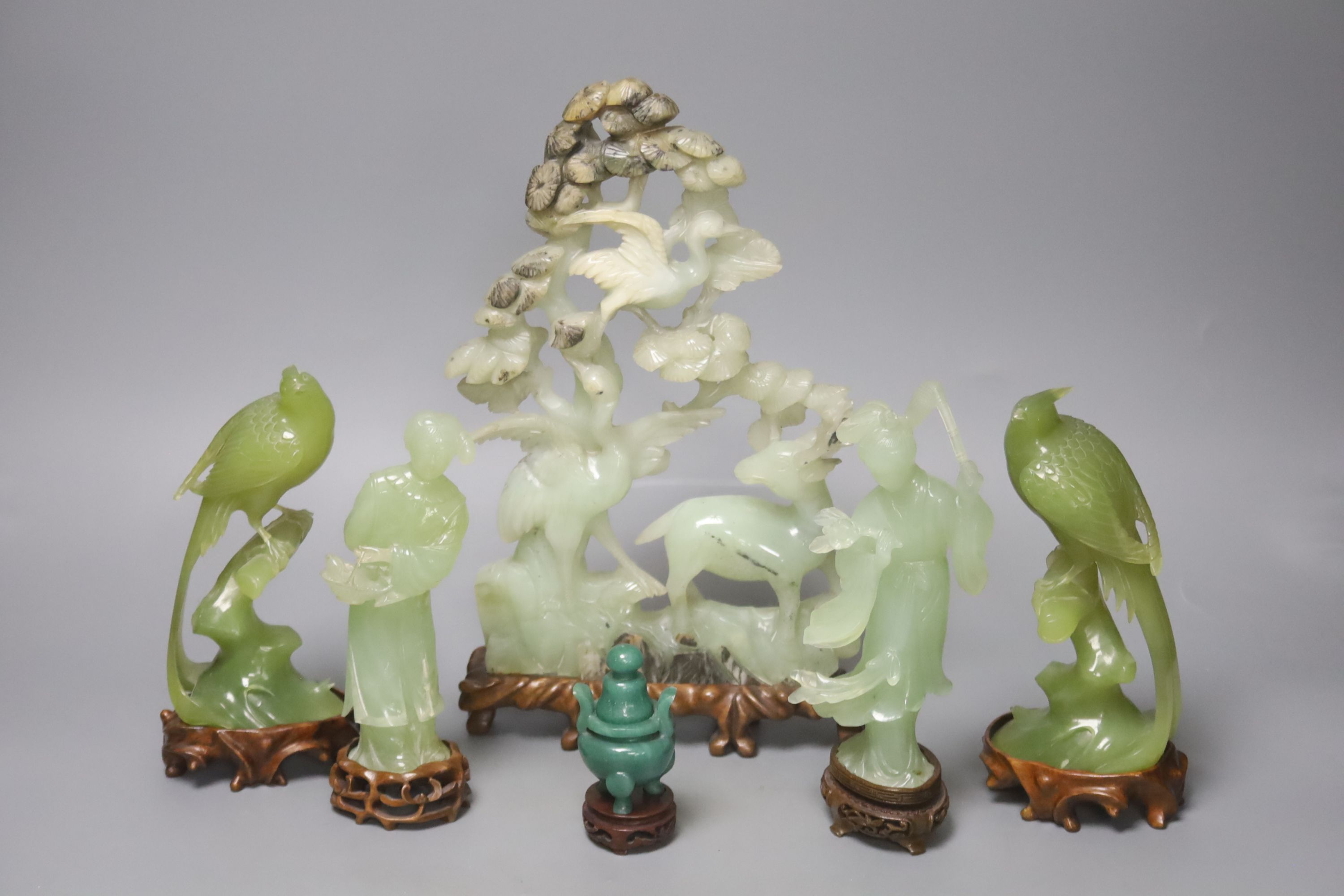 A pair of Chinese bowenite carvings of exotic birds on a branch and four Chinese hardstone items,